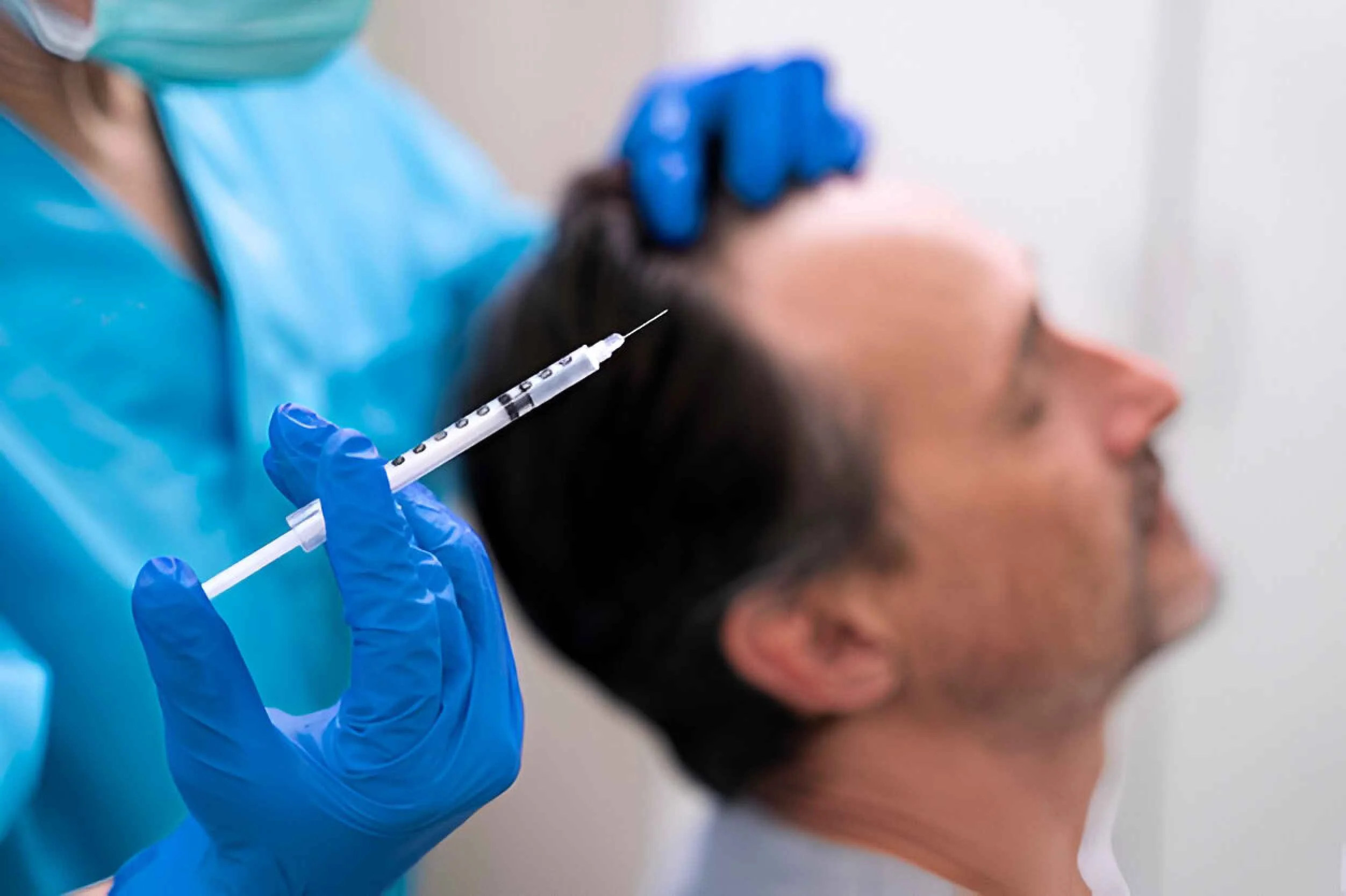 Man getting a hair loss treatment (1)